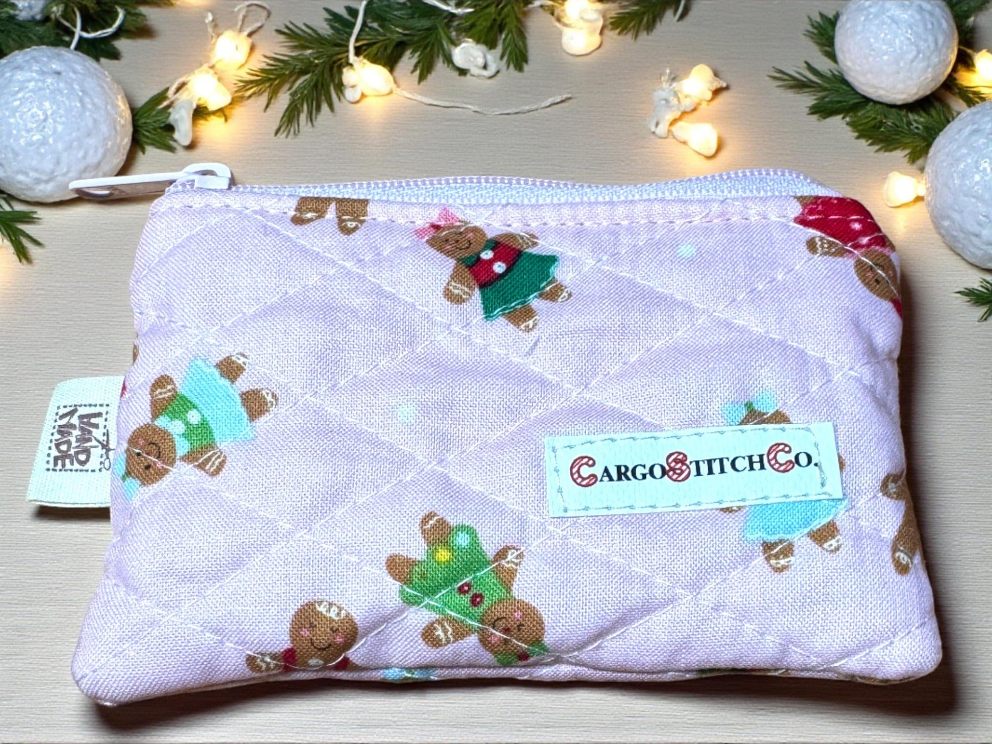 Soft pink 5×3 quilted pouch with gingerbread figures in pastel colors, pink zipper, no pocket — handmade Peppermint Lane Everyday mini purse.