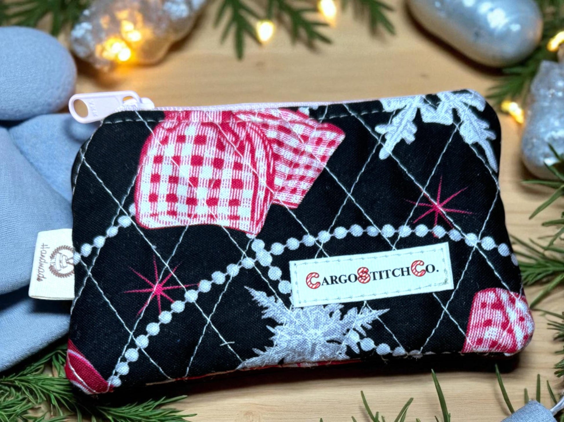 Black background 5×3 quilted pouch with red and white ornament pattern, pink zipper, no pocket — handmade holiday bag by Cargo Stitch Co.